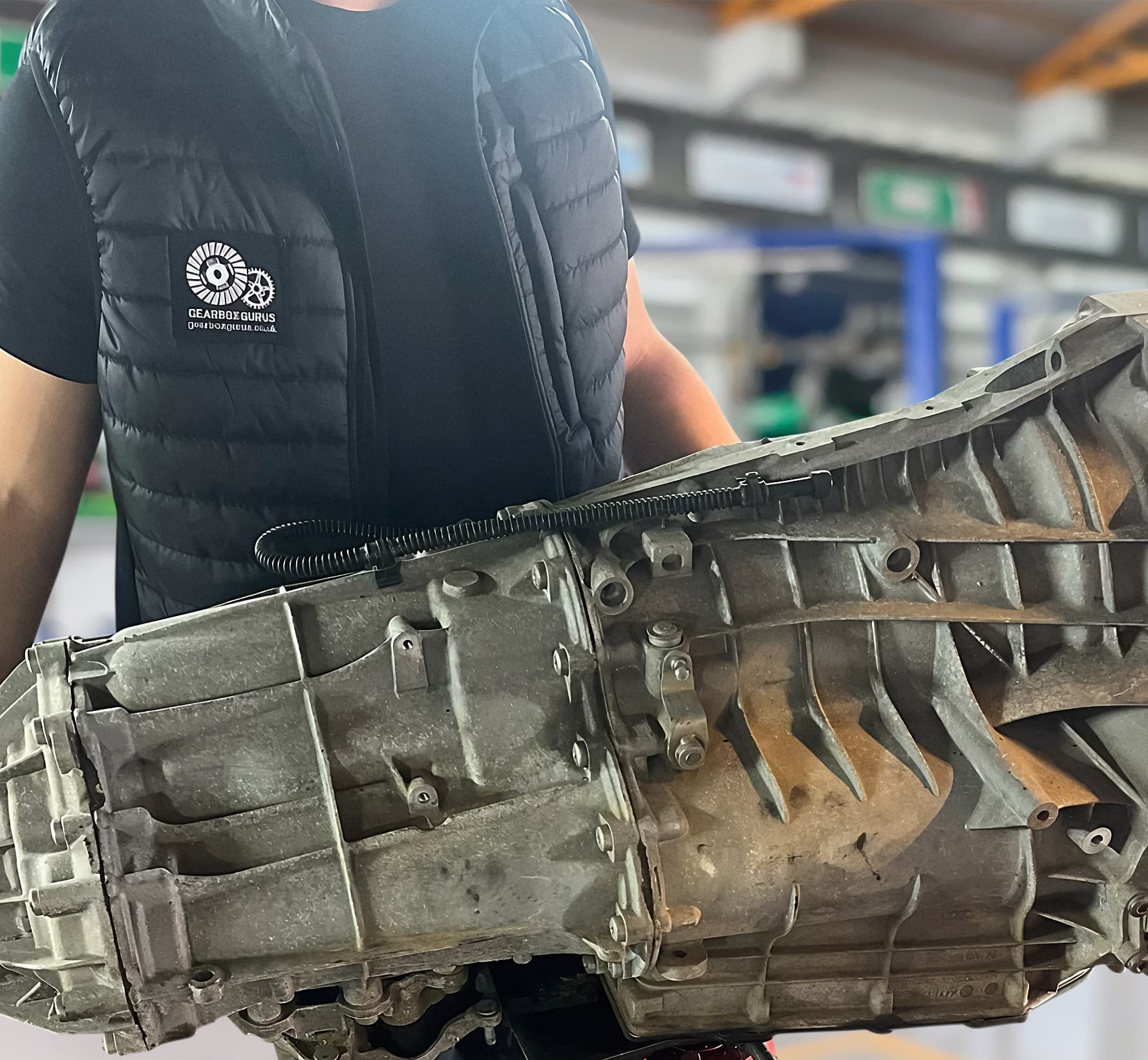 Gearbox Gurus technician holding an automatic gearbox