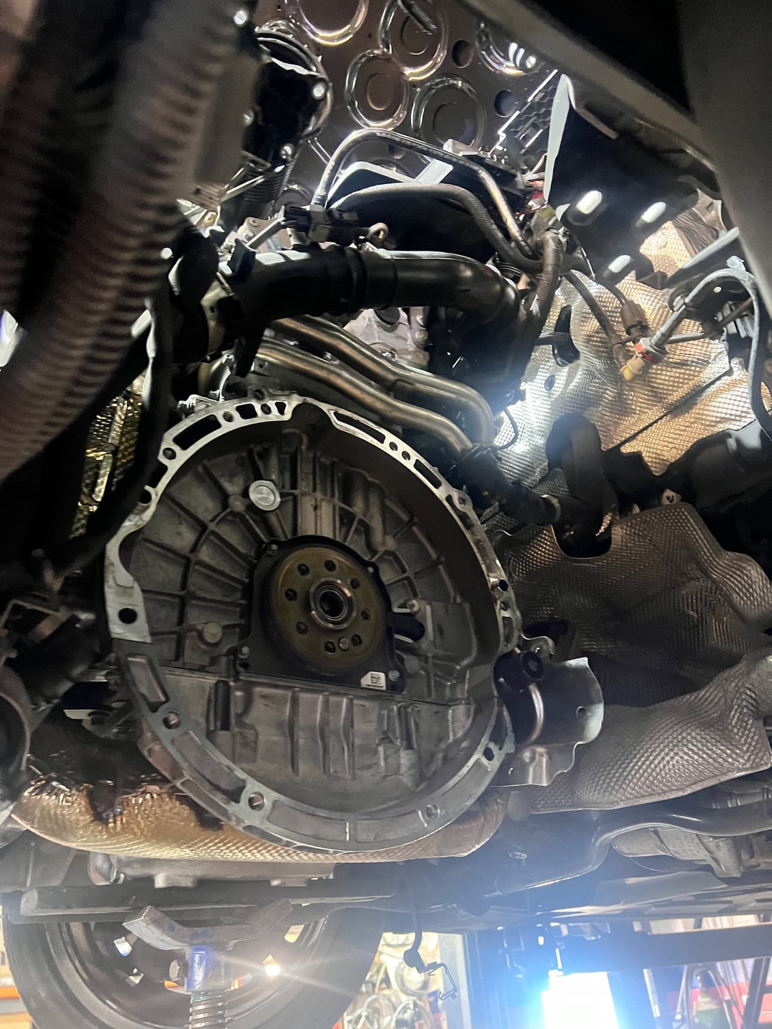 Gearbox Gurus technician working underneath vehicle on DSG gearbox